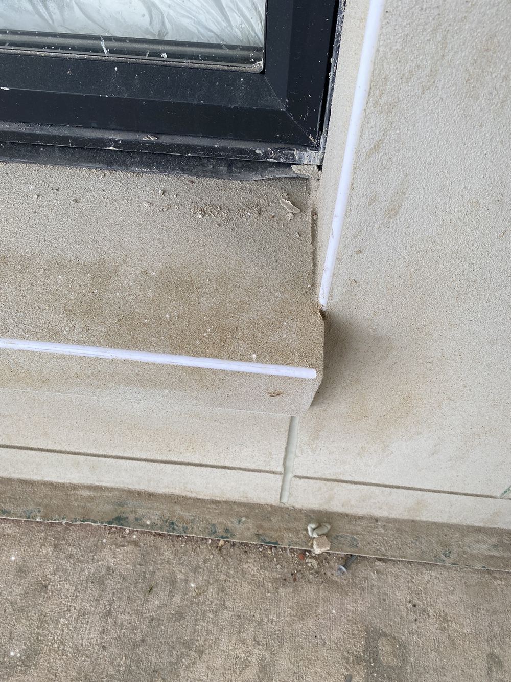 Expansion joint stopping short instead of running the full height of the wall, found during a fixing inspection in Gables