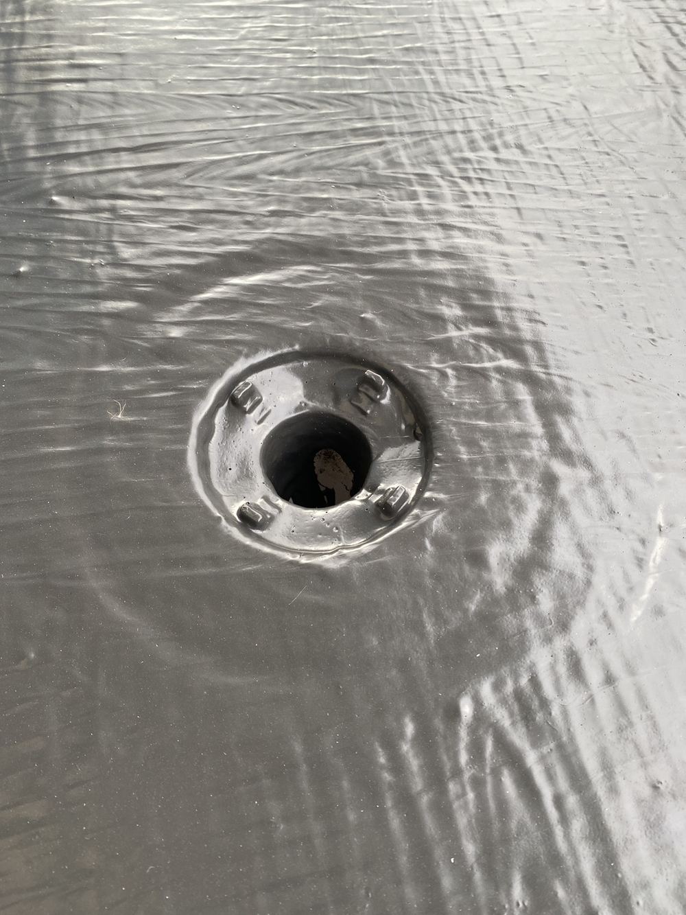 Balcony drain undersized for the water it has to carry away, found during a fixing inspection in Gables