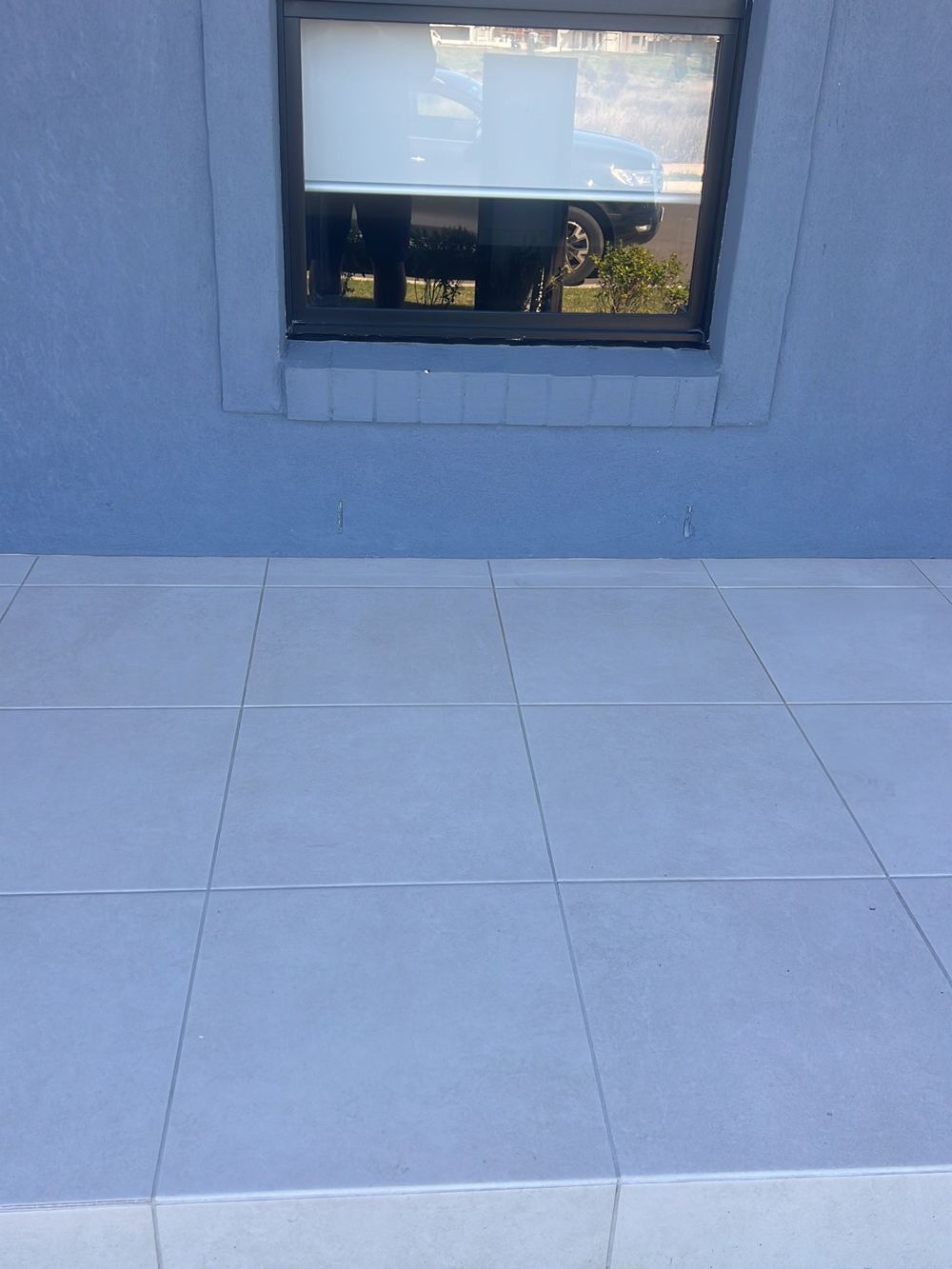 Obstructed weep holes still present when the house was rechecked, found during a handover inspection in Gables
