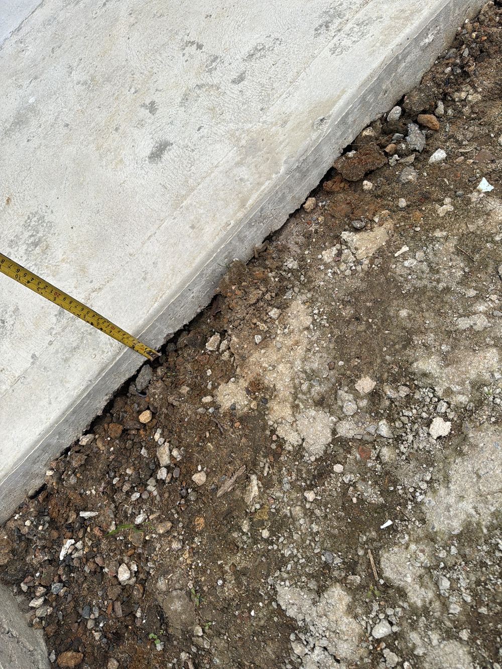 Driveway slab depth irregular and thinner than the minimum required, recorded during a defect investigation in Ermington
