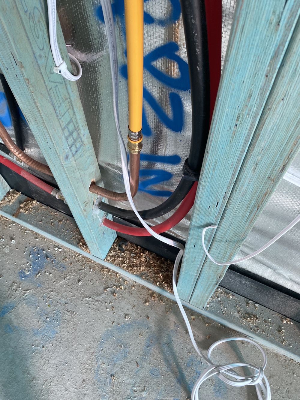Cold water pipe touching cabling where a 25mm gap should be kept, Gables