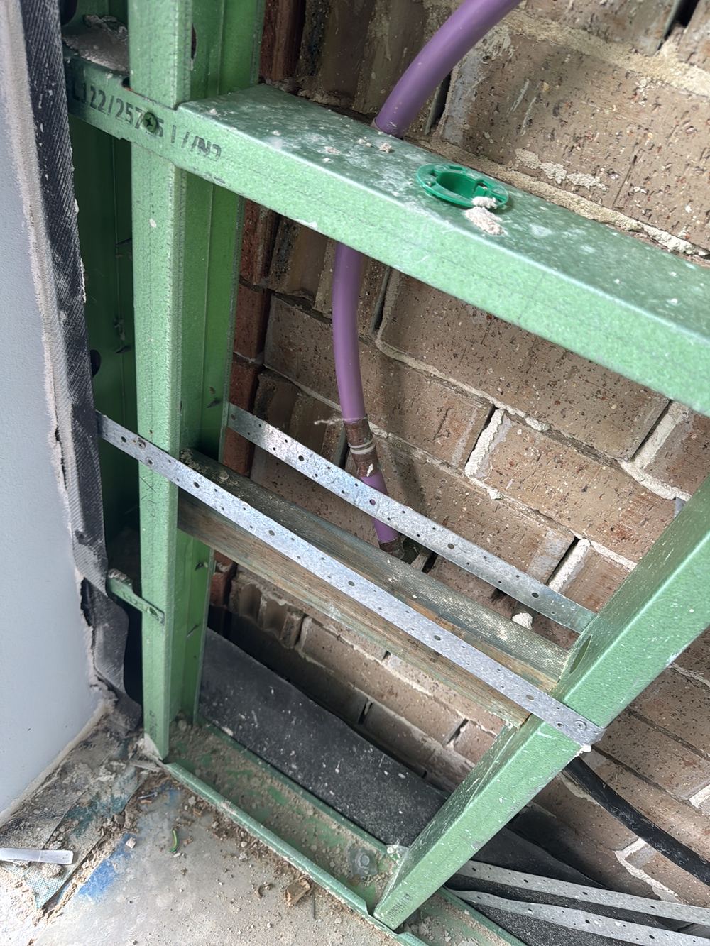Water pipes in direct contact with steel framing, needing a separator fitted, Gables