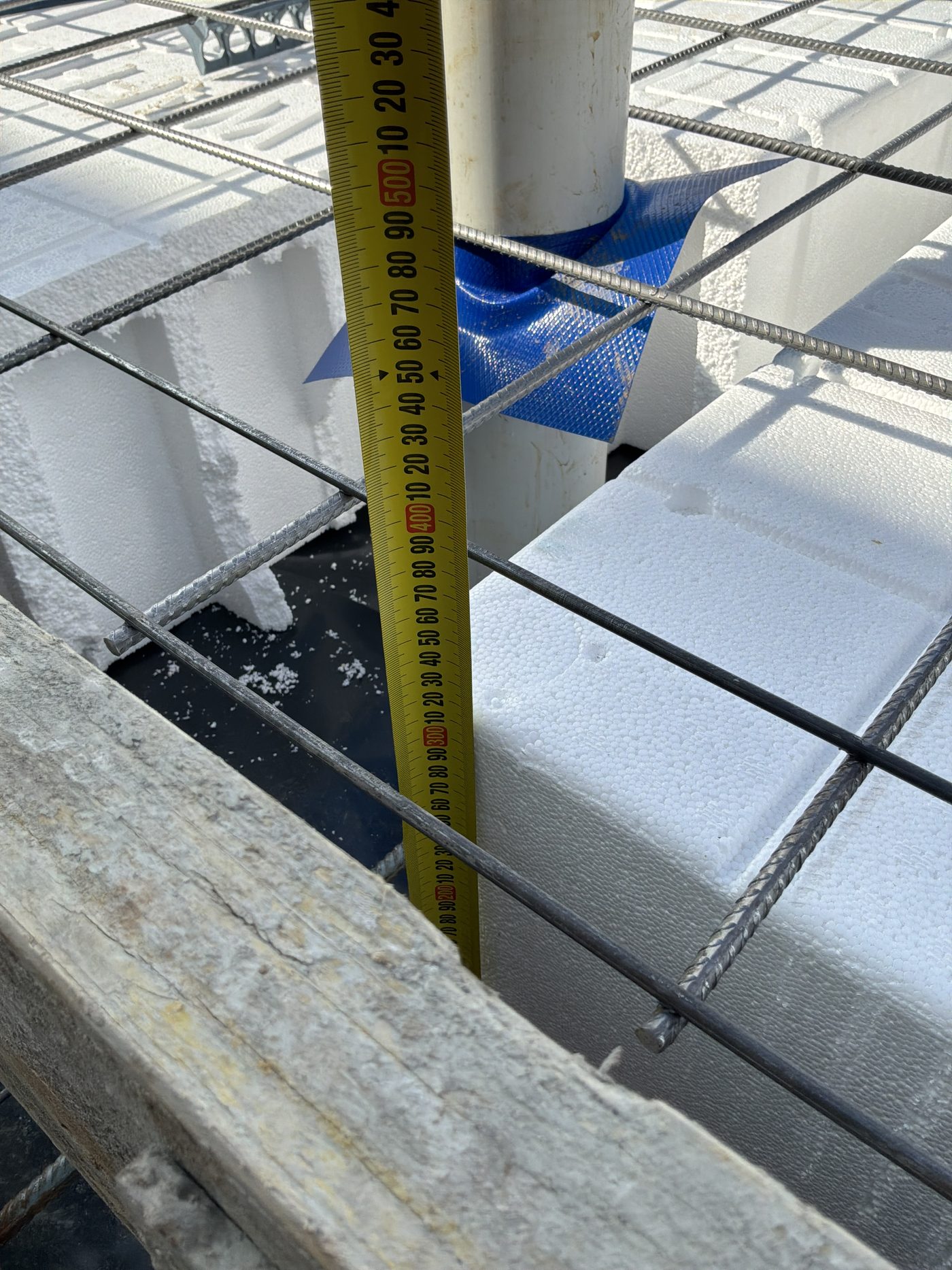 Waffle pod slab set out ahead of the pour, with beam spacing being checked, Gables