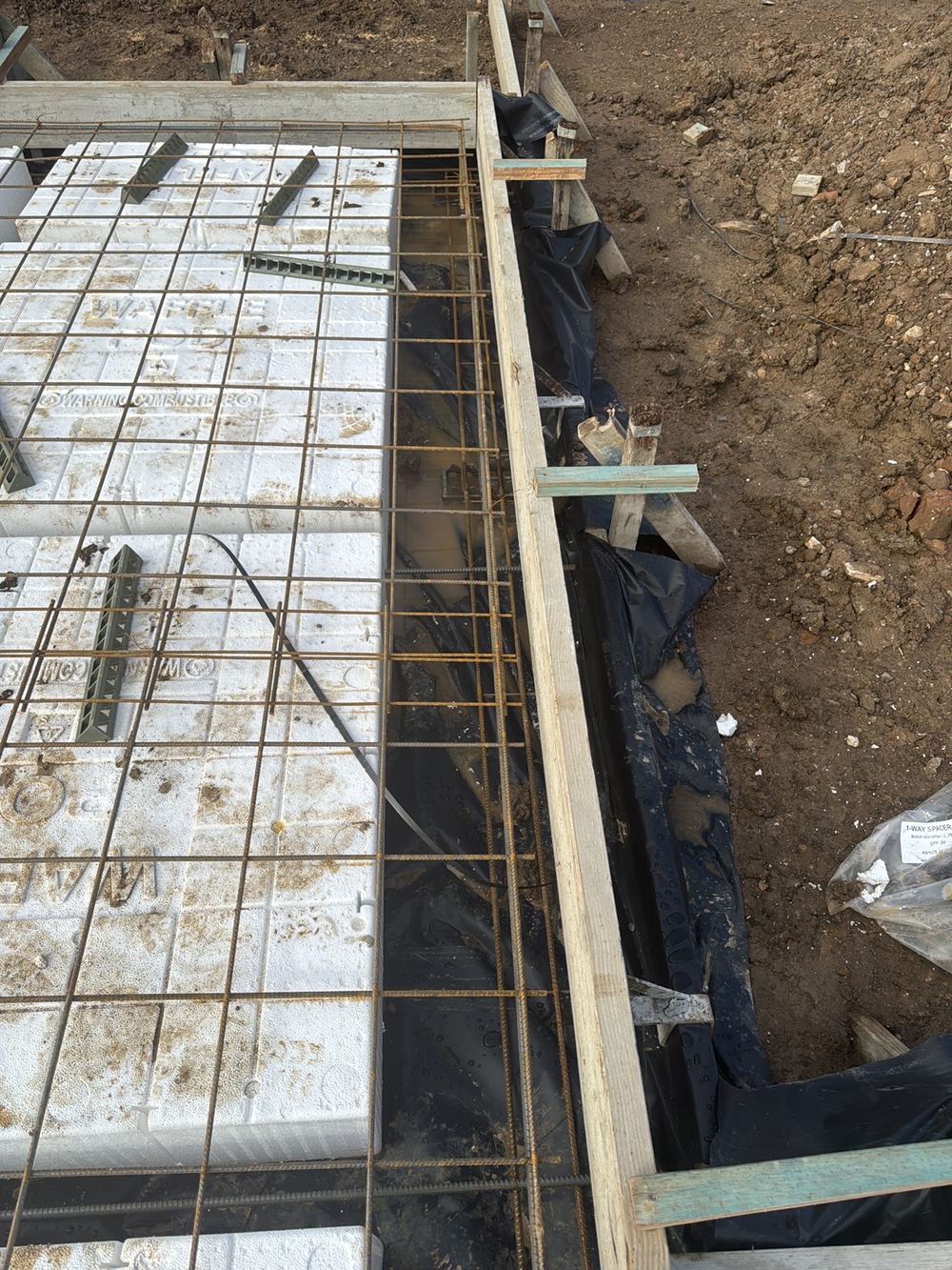A widened edge beam carrying no additional bottom bar for the added width, Gables