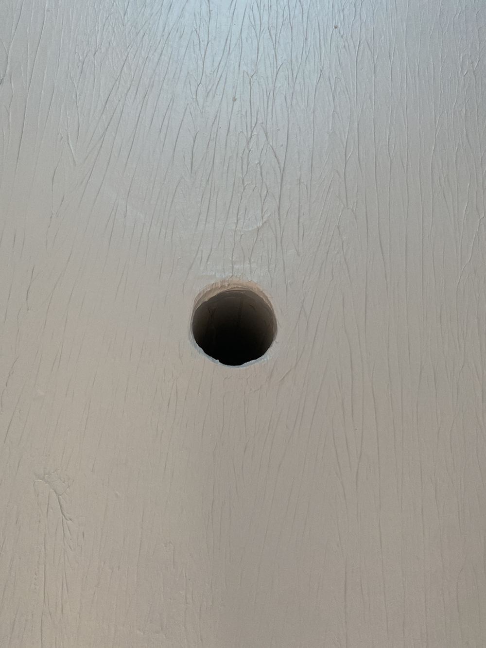 Laundry floor drain with no puddle flange installed under the membrane, found during a waterproofing inspection in Gables